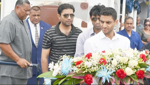 In this Samoa News file photo, is Cyrus Suleman, front, and two relatives behind, him preparing to lay at sea one of the six wreaths during the memorial service at sea on Sunday, July 27, 2014, for Barbar and his 17-year old son Haris, who died in a plane crash off the Tafuna airport on July 22, 2014.  Cyrus, who is from England, is the eldest son of Barbar Suleman and the older brother of Haris. [photo: SN file]
