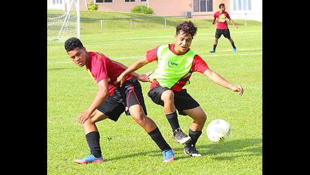A Tafuna Warriors’ player and Faga’itua Vikings’ opponent, in action during an ASHSAA Boys’ varsity soccer game Friday, April 6, 2018 at Pago Park Soccer Stadium.  [FFAS MEDIA/Brian Vitolio]