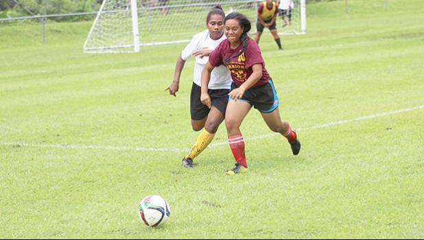Tafuna’s Shaloriana Tauaofa successfully defends against the Cougars’ Adi Muanivanua during their ASHSAA Girls varsity soccer game on Monday, Feb. 4, 2017 at Pago Park Soccer Stadium.   [FFAS MEDIA/Brian Vitolio]