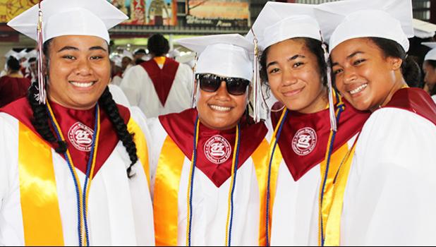 Some of the fellow graduates who continue to smile despite feeling sad at leaving this chapter in their life — high school at the Warrior Nation.  [photo: EM]