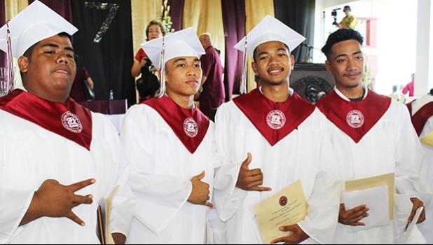 Proud warriors who celebrated their last chapter at Tafuna High School yesterday.  [photo: EM]