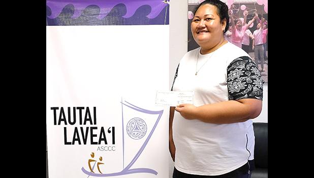 Tauga accepting the ASCCC stipend for her dad – Fala Tiatia who is one of the  two men recently diagnosed with colorectal cancer, which is on the rise in American Samoa. [courtesy photo]
