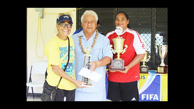 Tafuna Jets’ club president Naomi Oney, left, and the women’s team captain and league MVP Beulah Oney, right, receive their awards from FFAS President Faiivae Iuli Alex Godinet during the awards ceremony for the 2016 FFAS National League that ended on November 26, 2016 at Pago Park Soccer Stadium.  [FFAS MEDIA/Brian Vitolio]