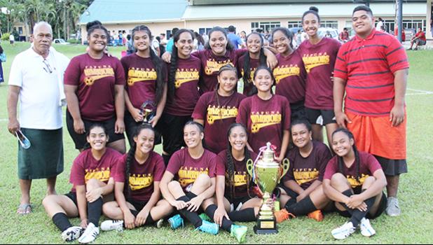 The Tafuna Warriors’ Girls Junior Varsity team, champions of their division after winning against the Samoana Sharks in the championship game that went to a penalty kicks shootout (5-4) to determine the winner after the game ended in a 1-1 draw.  [FFAS MEDIA/Brian Vitolio]