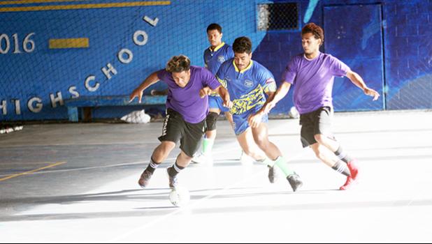 A Taputimu Youth player in action against two PanSa opponents during the 13th Place Tier competition of the 2017 FFAS Futsal Tournament on Monday, May 29 at the Samoana High School gymnasium in Utulei.  [FFAS MEDIA/Brian Vitolio] 