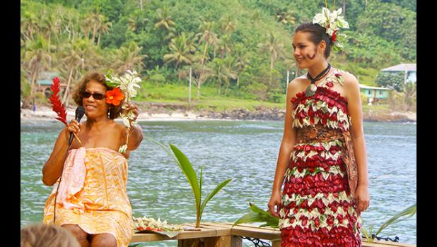 In this Samoa News file photo, Tattoo Fest founder Tisa Faamuli explains the cultural significance of some of the native plants and symbols used in this modern version of traditional dress. Tisa’s 12th Annual Tattoo Festival will be the most informative and fun packed indigenous tattoo event ever — For details read story below. [SN file photo]