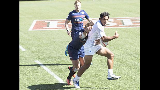Tila Mealoi getting redy to offload against Scotland. [photo: Joe Hamby]