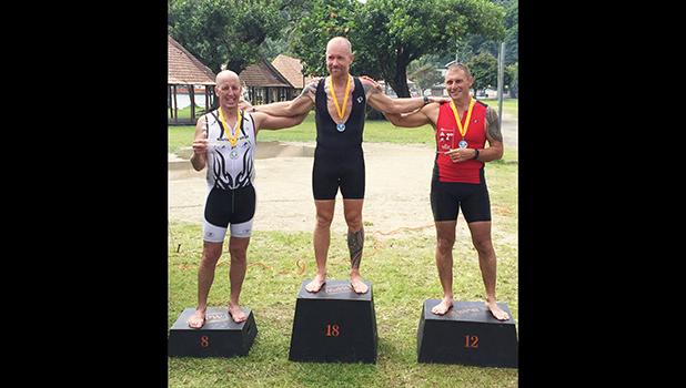 Winners of the Olympic Triathlon Course (1 mile swim, 24.6 mile bike, 6.2 mile run) that took place last Saturday at Utulei Beach: third place Matt Bracken, second place Patrick McEntire and first place Richard Birgander.  [photo: Ese Malala]
