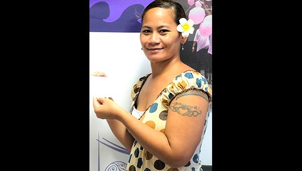 Moli accepting the ASCCC stipend her dad, Fiaui Uikilifi who is one of the  two men recently diagnosed with colorectal cancer, which is on the rise in American Samoa. [courtesy photo]