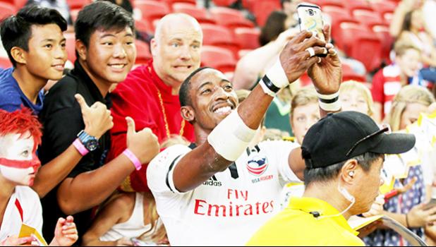 Perry Baker's blazing speed has made him the hottest star on the HSBC 7s Circuit, always asked for selfies here at the Singapore Sevens, Day 1, National Stadium, Singapore [Photo: Barry Markowitz]