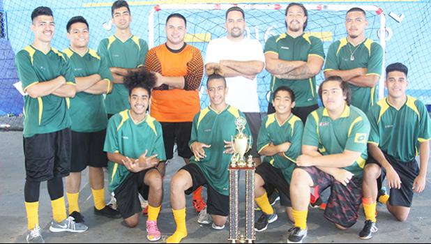 Utulei Youth, the 2017 FFAS Futsal Tournament champions with their trophy after the 2- 1 shootout (1-1) win against Pago Youth 1 on Monday, May 29 at the Samoana High School gymnasium in Utulei. [FFAS MEDIA/Brian Vitolio] 