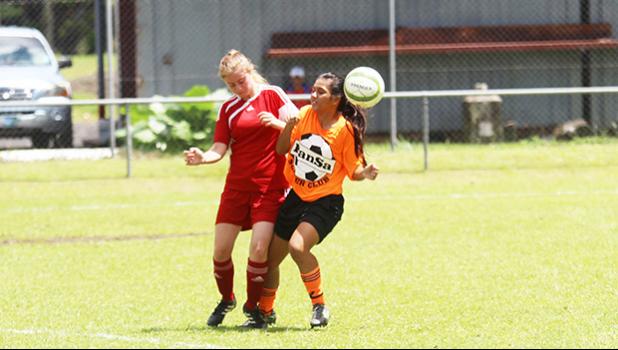 A Vaiala Tongan player, left, and PanSa opponent battle for possession of the ball during a women’s Match Day 2 game of the 2017 National League on Saturday, Sept. 9, 2017 at Pago Park Soccer Stadium. Vaiala Tongan won 2-1. [FFAS MEDIA/Brian Vitolio]