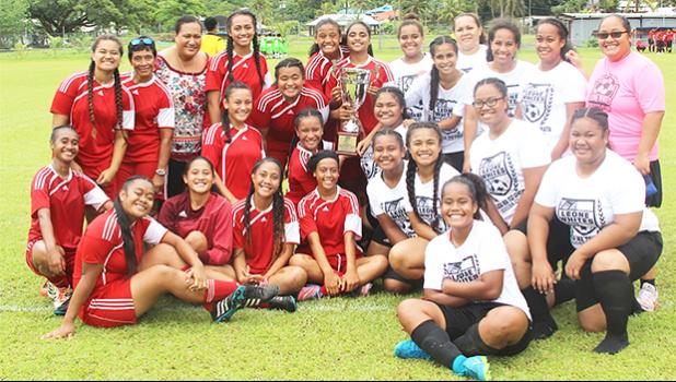 The Vaiala Tongan and Ilaoa & To’omata women’s teams are pictured with the women’s FFAS National Cup after their game on Saturday, Sept. 23, 2017 at Pago Park Soccer Stadium. Vaiala Tongan took the cup away from Ilaoa & To’omata following a 6-0 win. See story in today’s Sports section. [FFAS MEDIA/Brian Vitolio]