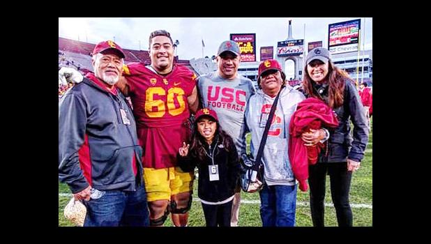 Trojans #60 Viane Talamaivao with his grandparents Tasi and Imeleta Asuega and uncle Johnny Nansen, Assistant Coach for the USC Trojans.  [Courtesy photo]