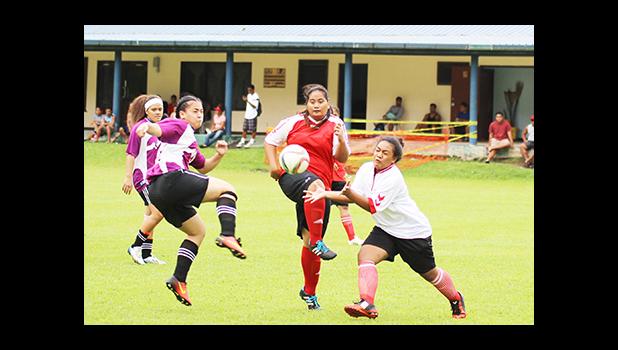 Tafuna Jets captain Beulah Oney (middle) defends against PanSa’s Titiula Manuma (left) during the women’s Cup challenge game on Match Day 5 of the 2016 FFAS National League on Saturday, Sept. 17, at Pago Park Soccer Stadium.  [FFAS MEDIA/Brian Vitolio] 