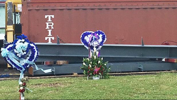 A look at the Manu’a’s Store compound after three employees of the store passed away from their injuries during an electrocution accident that happened on site. Seen here are banners and flowers in honor of the three Manu’a’s Store employees, Iosefa Elia, Saito Paulo and Toese “Masta Tee” Ume. The area is still cordoned off, but DPS is no longer present at the site. The lawn has been mown since the accident.  [Photo: JL]