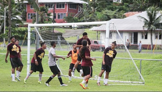 Tafuna Warriors’ Willie Malele heads away a dangerous, SPA Dolphins’ corner kick, during their ASHSAA Boys semifinal game earlier this week at Pago Park Soccer Stadium.   [FFAS MEDIA/Brian Vitolio]