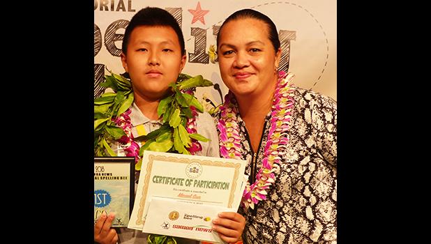 The winner of the 2018 Samoa News Spelling Bee with major sponsor representative — McDonald's American Samoa — Michael Sun of SPA- 1st place, and Carol Tautolo-Samuelu, GM of operations for McDonald's American Samoa. [photo: Leua Aiono Frost]