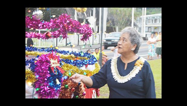 First Lady Cynthia Malala Moliga turns on the switch to light the official Christmas Tree of the Territory — at the Fagatogo Pavilion on Sunday, during the first night of the 39th annual Holiday Music Festival hosted by the American Samoa Council on Arts, Culture & Humanities and the Department of Youth and Women’s Affairs. Tonight is the last night of the holiday event. The public is invited to attend. [photo: AF]