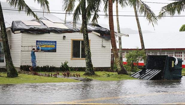 A look at the South Pacific Watersports in Utulei as workers tried to cover the blown off roof from Tropical Storm Gita this past weekend. [photo: TG]