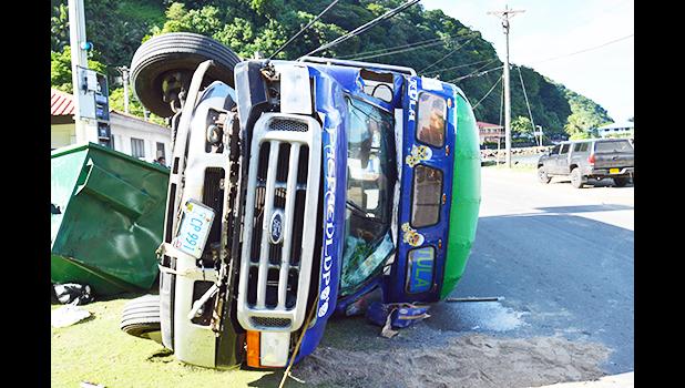 overturned bus in Aua