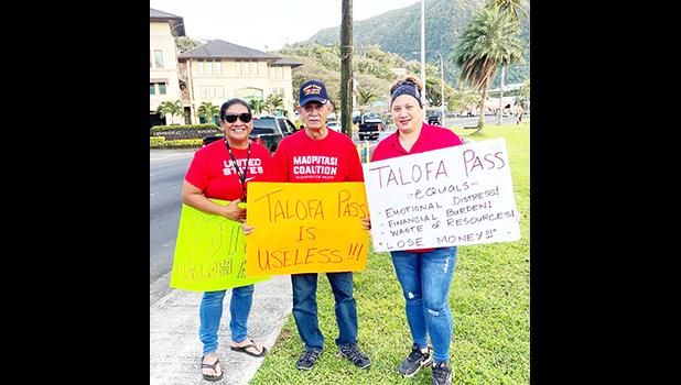 Pago Pago chief Pulu Ae Ae Jr., (middle)  protesters