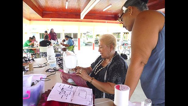 sewing instructor, Diana Tarrant teaching certain methods of sewing to a participant