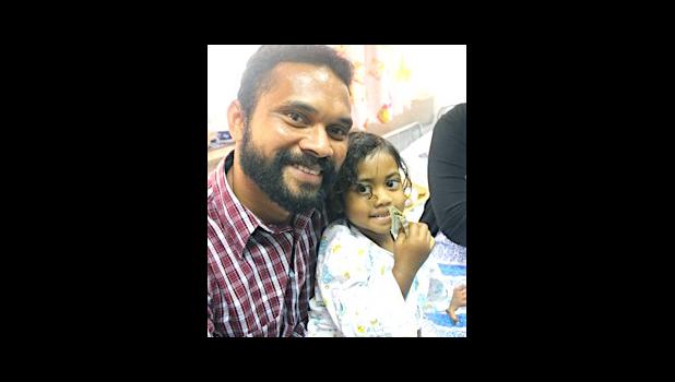 Three-year old Abigail Gaunavou and her father