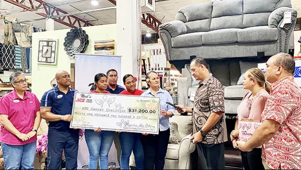 Ngaire Ho-Ching presenting check  to Toetasi Archie Soliai