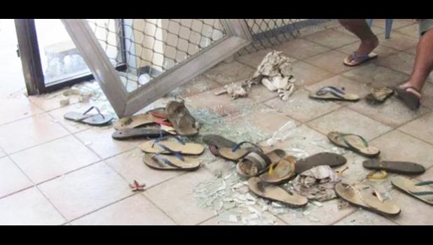 Broken glass and scattered slippers