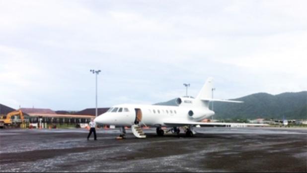 The Falcon 50 private jet on the tacmac at Pago Pago Int'l Airport
