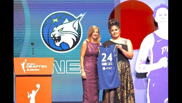 Utah’s Alissa Pili, right, poses for a photo with WNBA commissioner Cathy Engelber