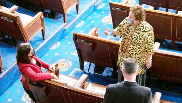Congresswoman Uifa’atali Amata speaking with an unidentified woman 