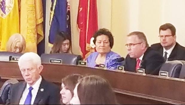 Congresswoman Amata seated by Ranking Member Bost