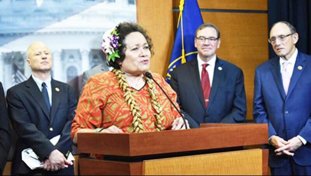 Aumua Amata speaking from podium