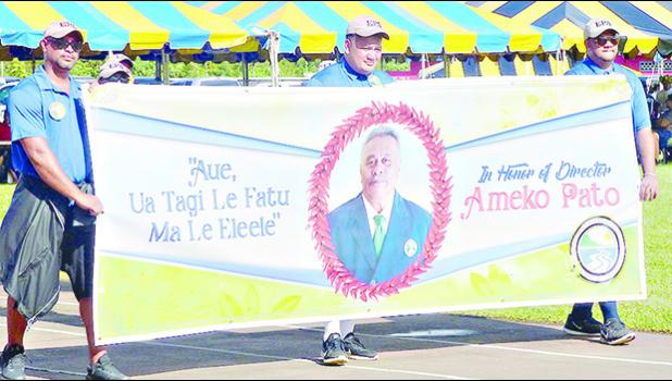American Samoa Environmental Protection Agency employees with a banner honoring the agency’s executive director Ameko Pato at last Friday’s Workforce Day at Veterans Memorial Stadium. 