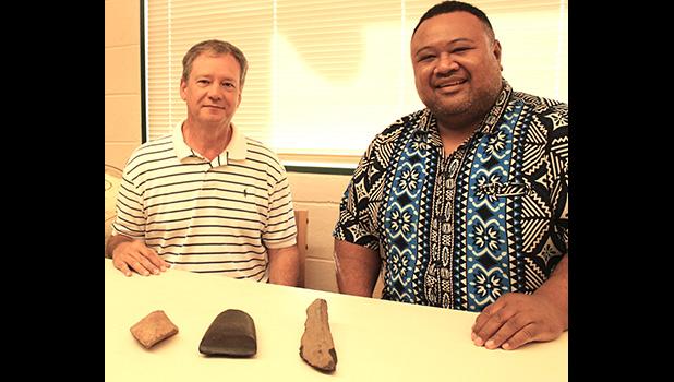 Earl Andersen (left) and Territorial Librarian, Justin Maga pictured yesterday at the Feleti Barstow Public Library where Andersen, on behalf of the Rev. Fred Andersen family, returned to the territory what appear to be stone artifacts 