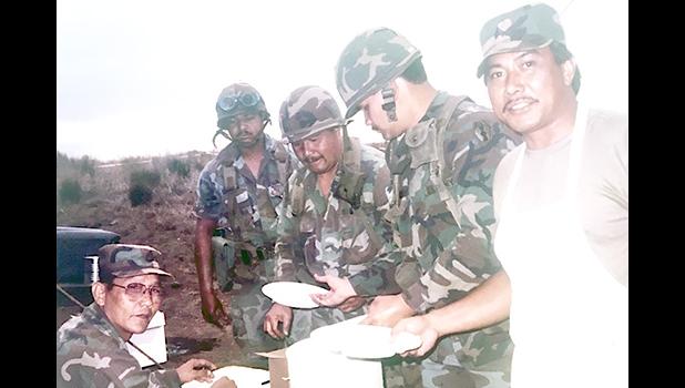 Historical photo of Army Reserve Soldiers from the 100th Infantry Battalion taking a break for a meal