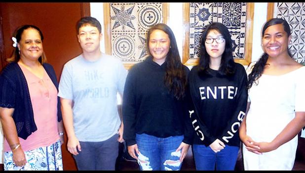 ASCC President Dr. Rosevonne Makaiwi Pato congratulates this semester's recipients of the College's in-house scholarships. (l-r) Dr. Pato, Jin Lin Du, Louaivasa Laulu, Jingling Jiang, and Rianna Lafaele.  [Photo: J. Kneubuhl]