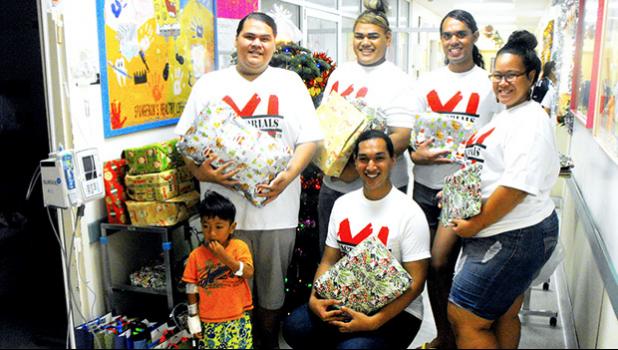 Members of the American Samoa Community College student club X-Factorials visit the LBJ Hospital Pediatric Ward to share some Christmas cheer