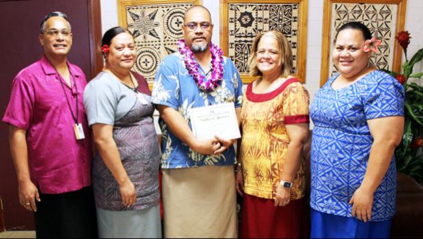 Dr. Rosevonne Pato (2nd left) and ASCC administrators celebrate with Dr. Kamo Koloi (center) 