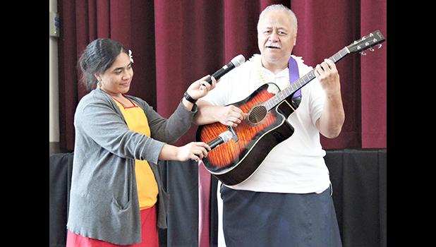 Tapa’au Dr. Dan Aga playing the guitar