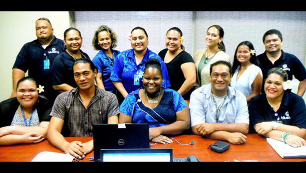 Computer Science Department chairman Ernie Seiuli (front, 2nd right) and Administrative Technician Officer Victor Ualesi (front, 2nd left), both from ASCC, lead a community training session for employees of BlueSky Communications. (Photo: J. Kneubuhl)