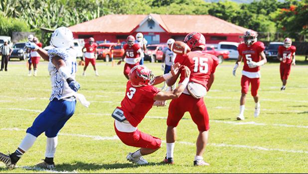 A pass from Anthony Feala intended for Alex Te’o is tipped, and seconds away from being intercepted by Deuteronomy Tafaovale of the Vikings during the second quarter of their playoff game last Saturday morning. The Vikes came up three points short in a 19-16 loss against the Blue Empire who will be playing in the championship game this Saturday against the Warriors.  [photo: TG]