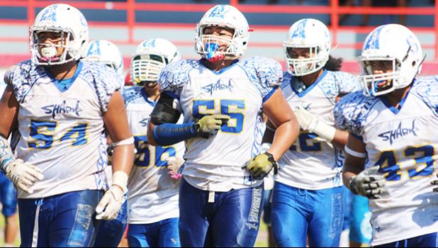 Samoana Sharks' defensive unit coming back on the field after a time out during their playoff game last Saturday at the Veterans Memorial Stadium. Samoana’s defensive unit led the way to a 19-16 victory over the Vikings and they will face the Warriors in the title game of the year this Saturday. [photo: TG]