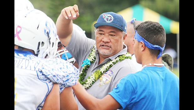 Samoana High School principal Tupa’i Rod Atafua encouraging the Sharks in a time-out during the championship game against the Warriors last Saturday morning, where the Blue Empire claimed this year's title with a narrow 7-6 win. [photo: TG]