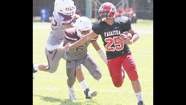Faga'itua's Jesse Toilolo powering his way through midfield and carrying this one for the Vikings deep inside Tafuna’s territory in the final quarter of their JV game last Saturday. The Vikings lost 14-24 against Tafuna.  [photo: TG]