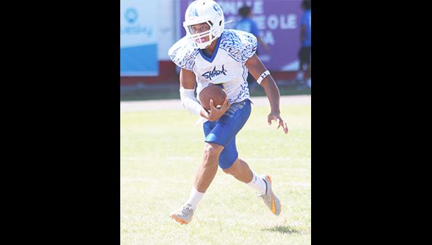  Samoana's Paul Fano storming towards the end zone with the fumble to score his first touchdown during the first half of a JV game against the Lions. Fano led the Sharks to a crushing 34-6 victory. [photo: TG]