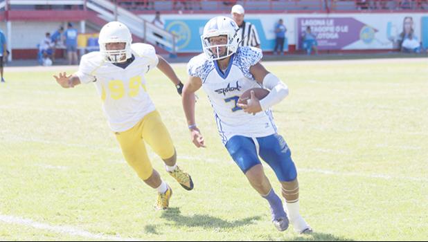 Samoana Sharks' JV Quarterback, Junior Tanielu racing towards the goal line for his first touchdown of the season – a quarterback keep in the second quarter. [photo: TG]