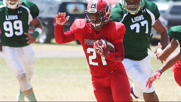 Advent Migi of the Vikings running this one straight into the end zone for his first touchdown of the game in the second quarter of play against the Lions last Saturday morning. Migi led the Vikes in a 50-20 win against Leone.  [photo: TG]